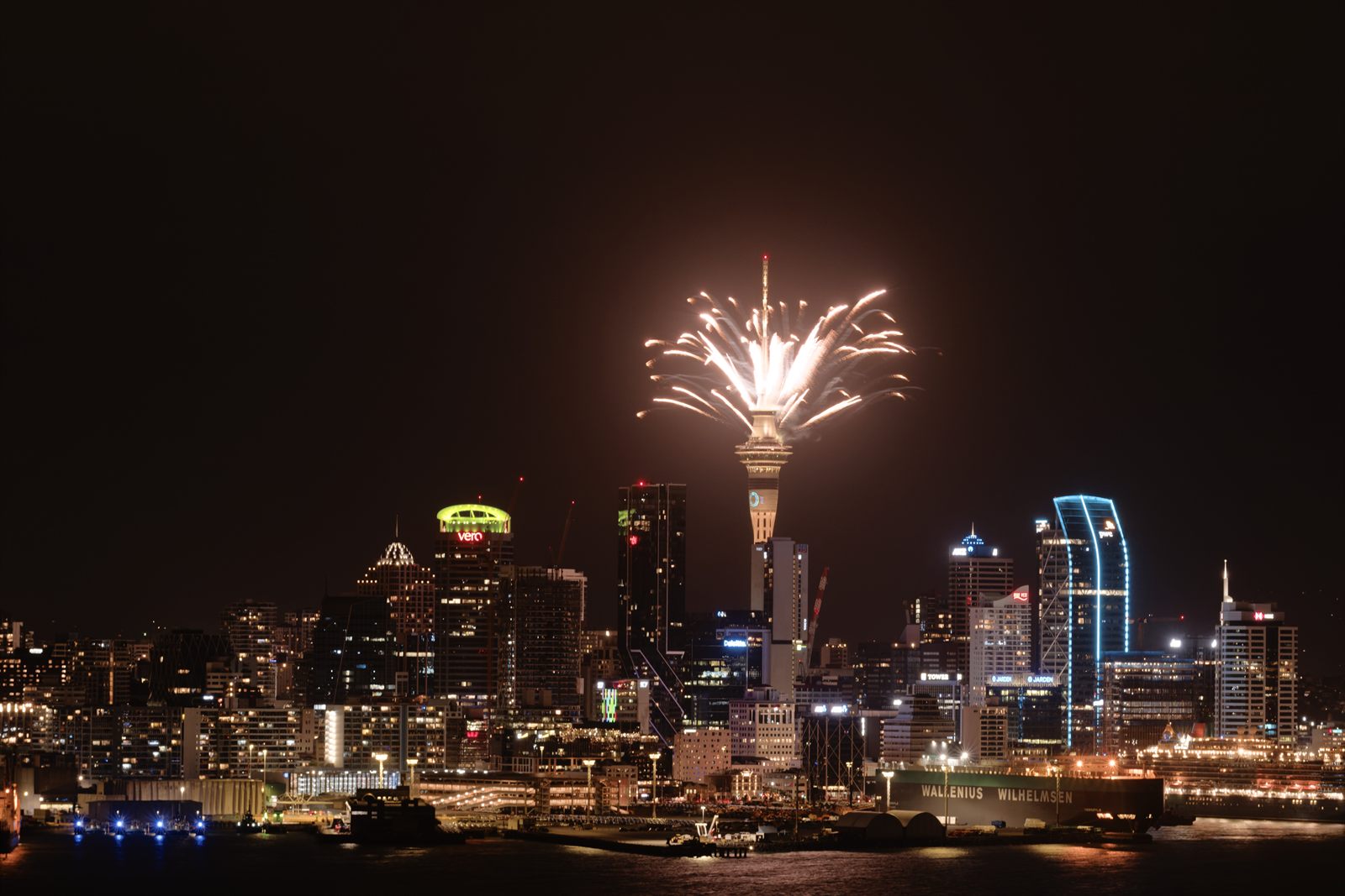 Auckland's Sky Tower rising above the city skyline at dusk